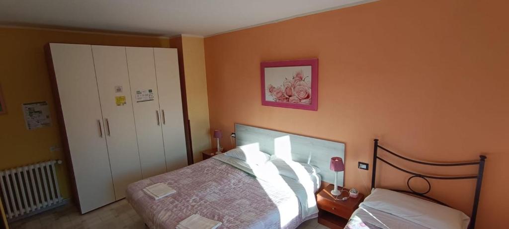 Postel nebo postele na pokoji v ubytování Complesso turistico Aurora - camere B&B