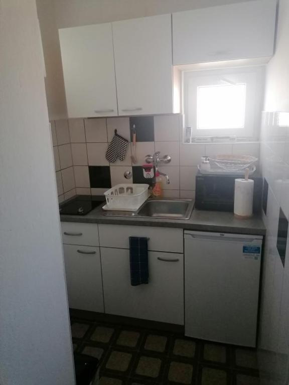 Kuchyňa alebo kuchynka v ubytovaní Villa Juni