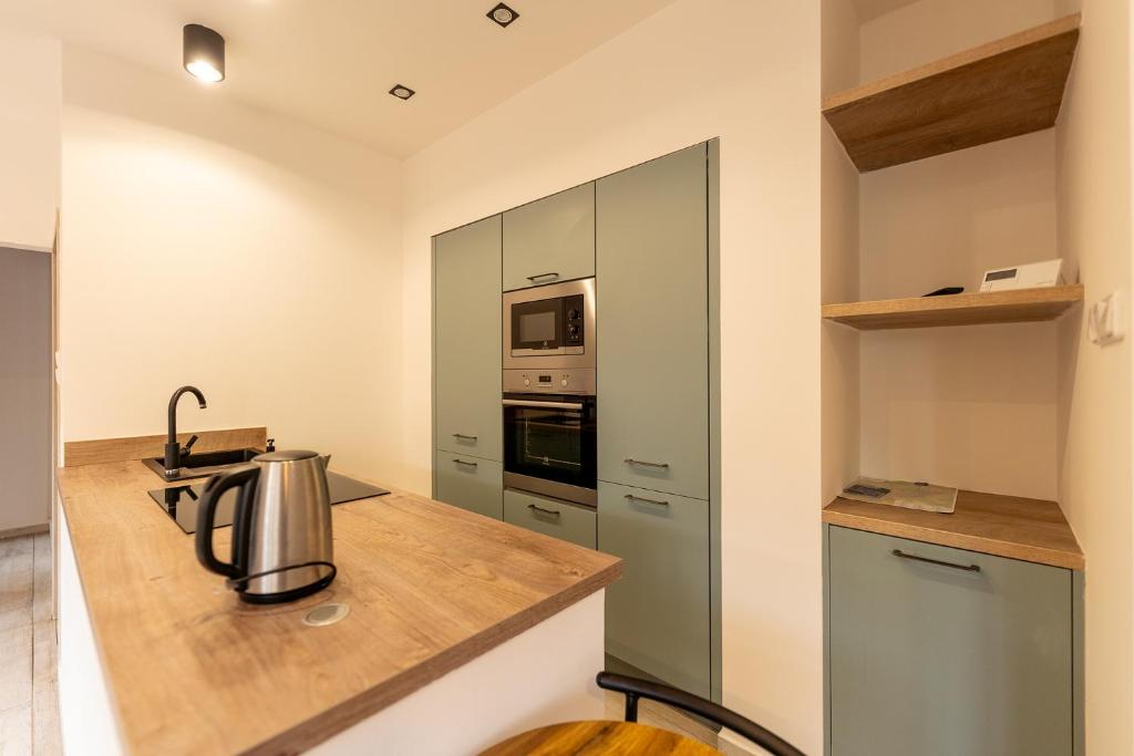 Kuchyň nebo kuchyňský kout v ubytování Apartmány Holiday