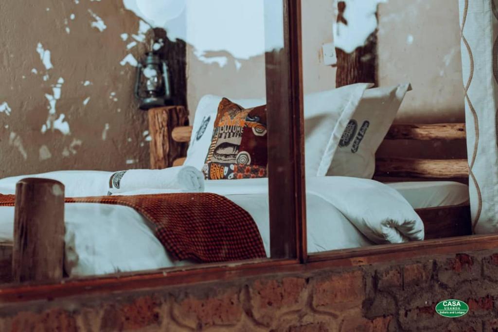 a mirror reflection of a chair with a skateboard on it at Sipi Falls Lodge in Sipi