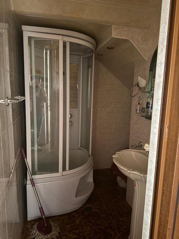 a bathroom with a shower and a sink at гостевой дом in Sevan
