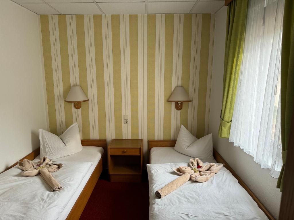 Postel nebo postele na pokoji v ubytování Goldene Krone