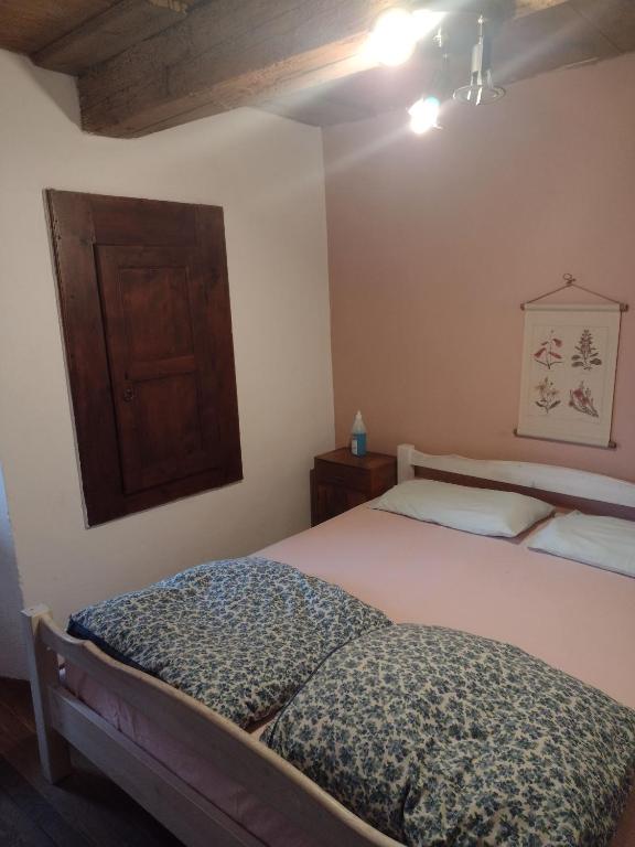 Postel nebo postele na pokoji v ubytování Rifugio Monte Zeus