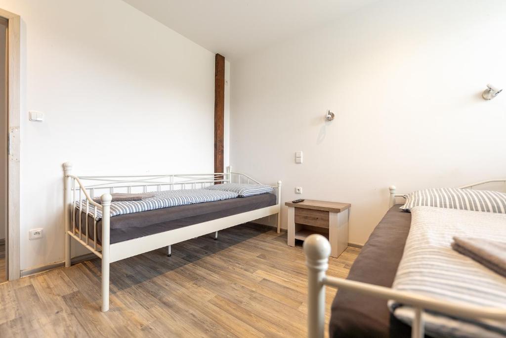 Postel nebo postele na pokoji v ubytování Apartmány Holiday