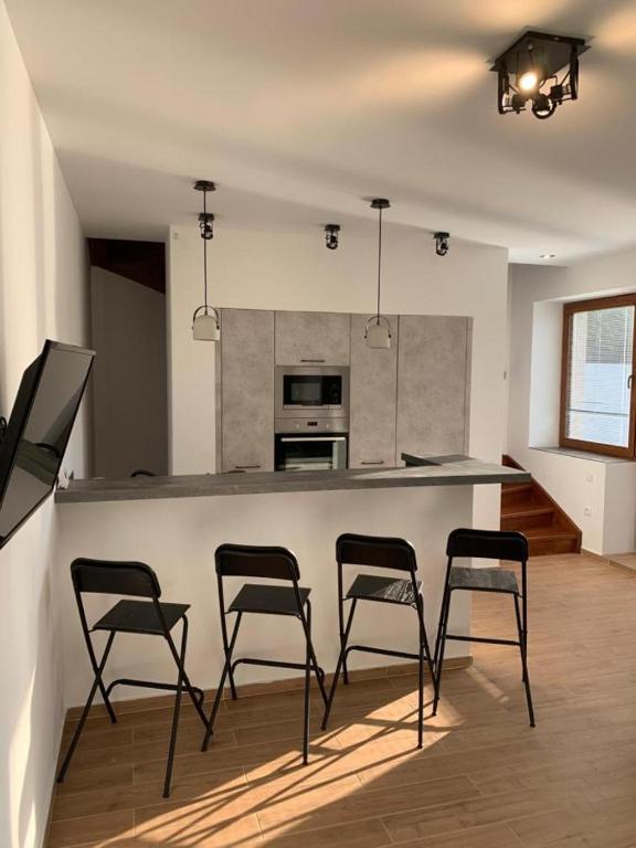 Kuchyň nebo kuchyňský kout v ubytování Apartmány Holiday