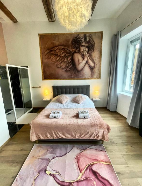 Postel nebo postele na pokoji v ubytování Les 3 anges de Sigean
