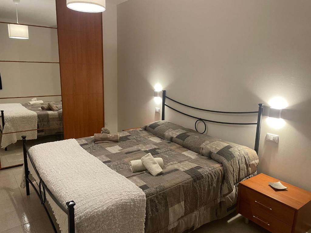 a bedroom with a bed and a dresser in it at CASA MAJA casa per vacanze abruzzo in Lettomanoppello