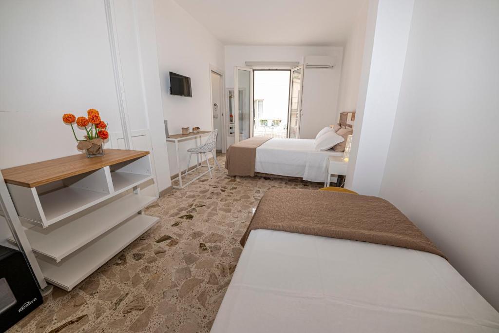 Postel nebo postele na pokoji v ubytování B&B - Le Tre Comari