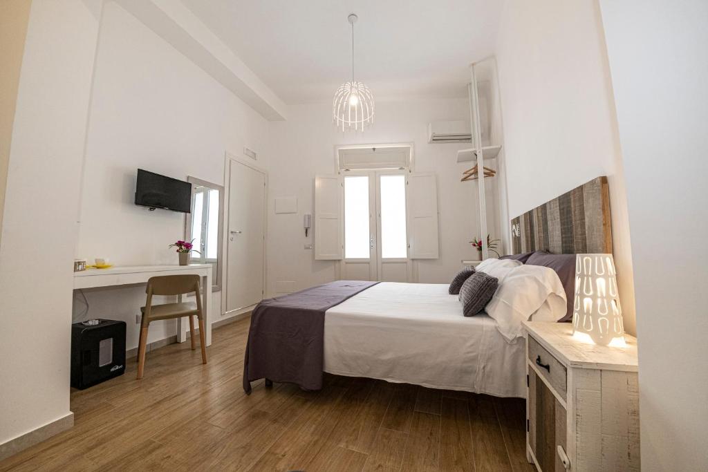 Postel nebo postele na pokoji v ubytování B&B - Le Tre Comari