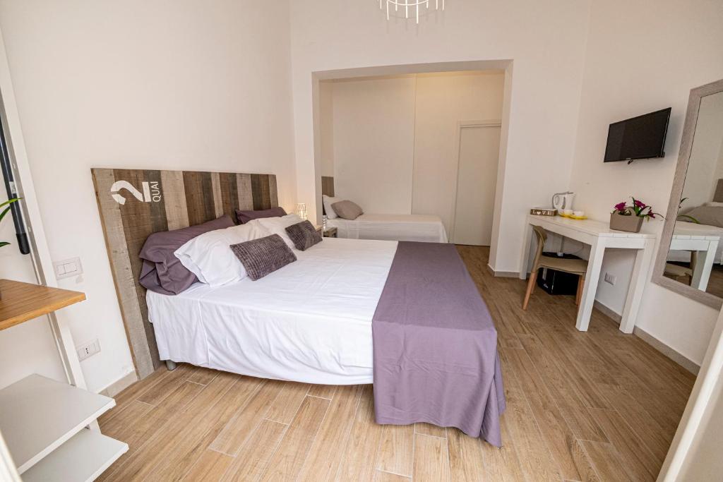 Postel nebo postele na pokoji v ubytování B&B - Le Tre Comari