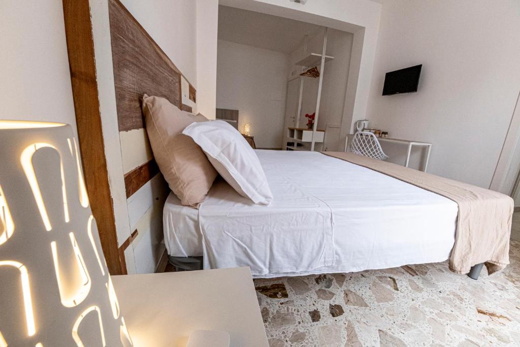 Postel nebo postele na pokoji v ubytování B&B - Le Tre Comari