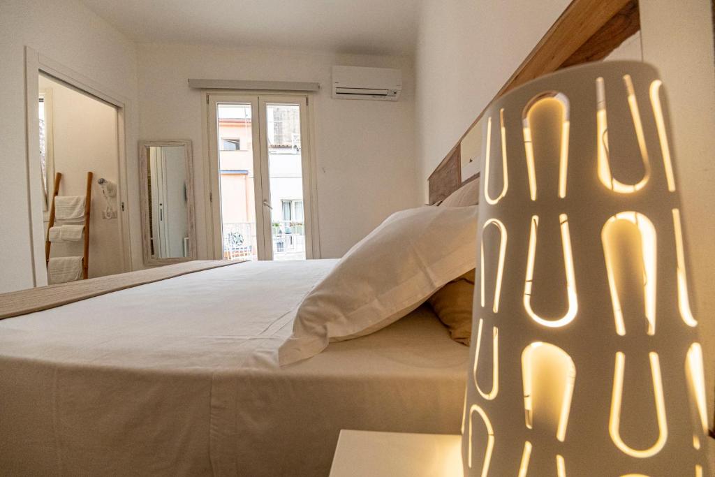 Postel nebo postele na pokoji v ubytování B&B - Le Tre Comari
