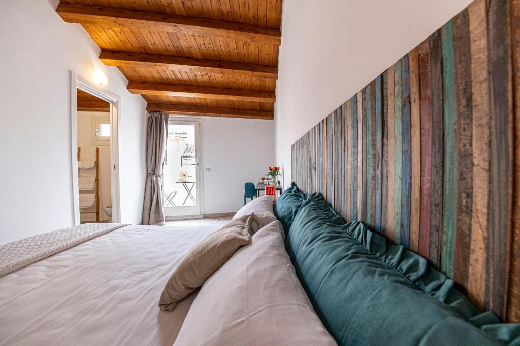 Postel nebo postele na pokoji v ubytování B&B - Le Tre Comari