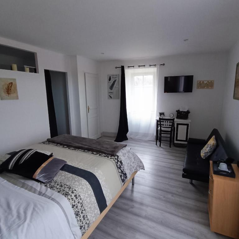 Postel nebo postele na pokoji v ubytování La Douce Parenthèse B&B entre bois et champs-Accueil motards
