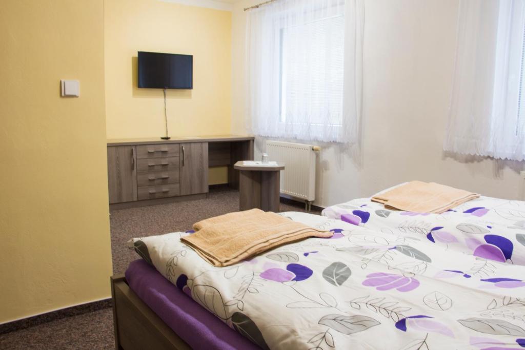 Letto o letti in una camera di Motel Pávov