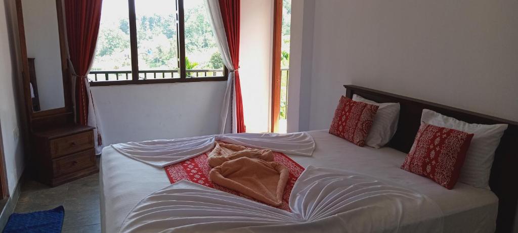 Postel nebo postele na pokoji v ubytování Kandy IVY Mountain View Resort