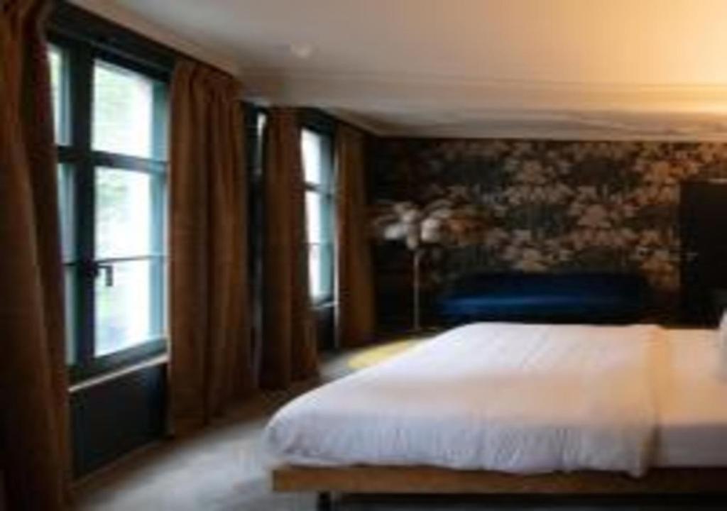 Postel nebo postele na pokoji v ubytování Nonam Boutique Hotel Gent