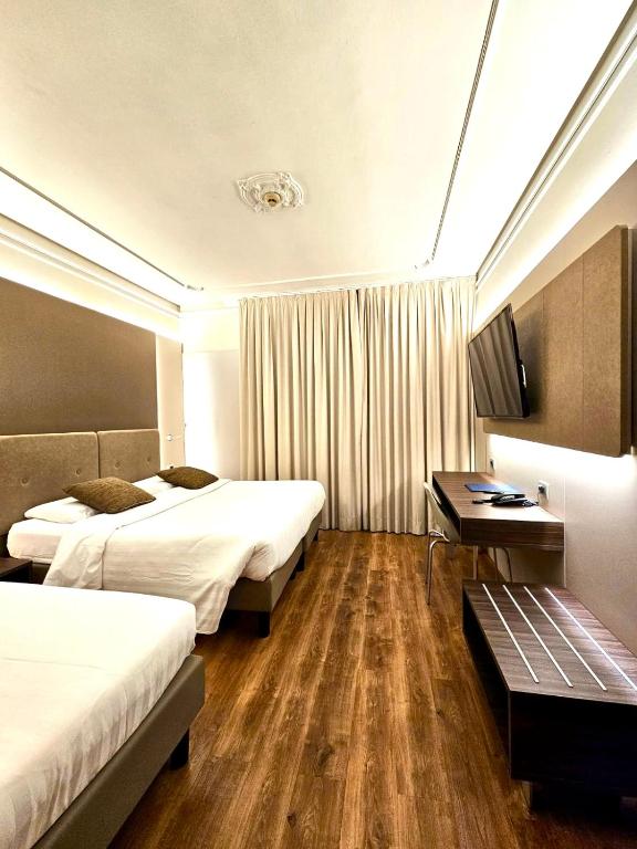 Posteľ alebo postele v izbe v ubytovaní Hotel Mythos