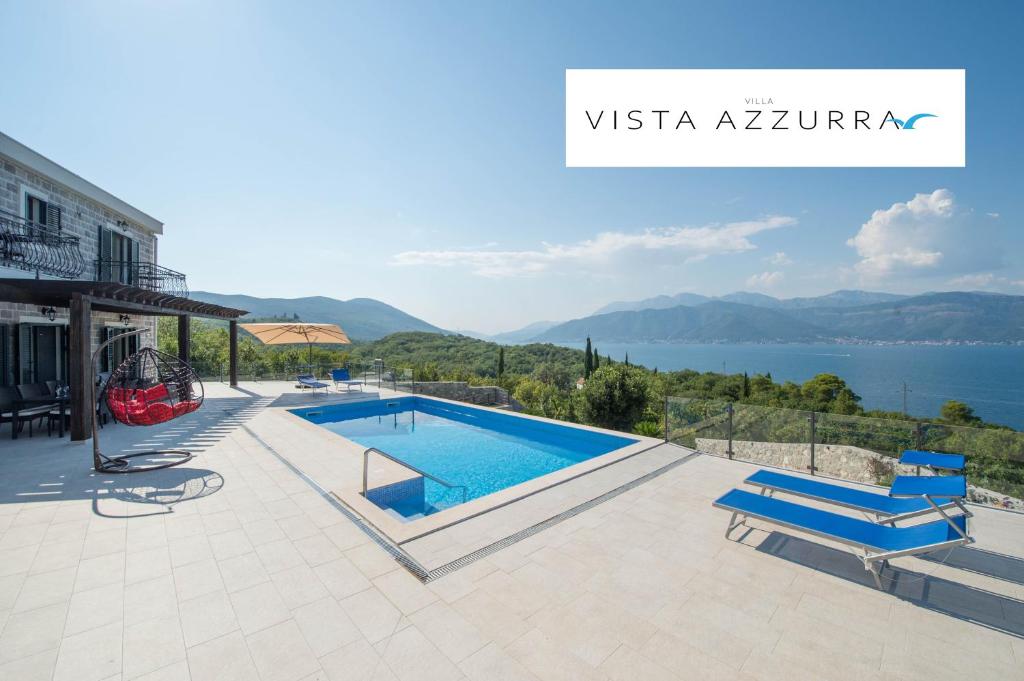 a villa with a swimming pool and a view of the water at Villa Vista Azzurra in Tivat