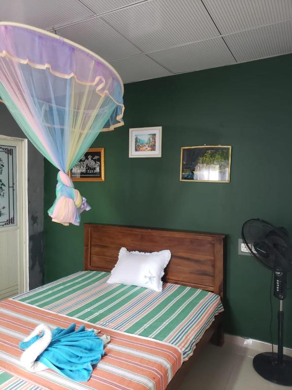 Postel nebo postele na pokoji v ubytování Tiny Homestay