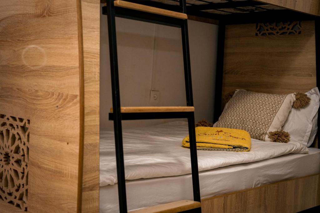 Postel nebo postele na pokoji v ubytování Soul Surf House Anza