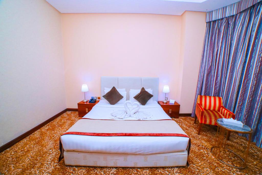 Postel nebo postele na pokoji v ubytování GREEN GARDEN HOTEL