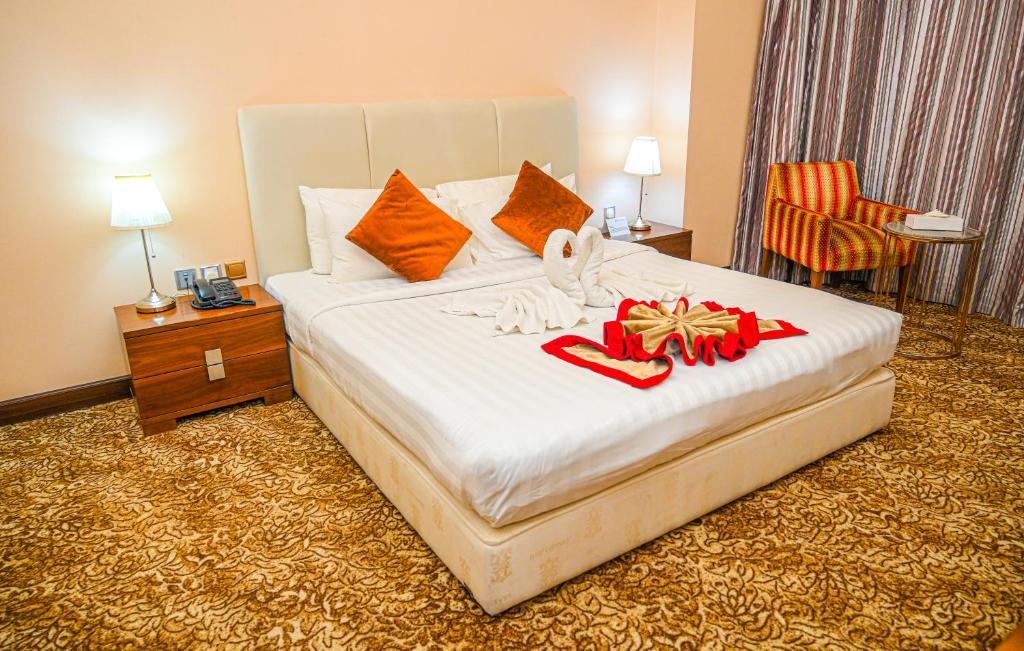 Postel nebo postele na pokoji v ubytování GREEN GARDEN HOTEL