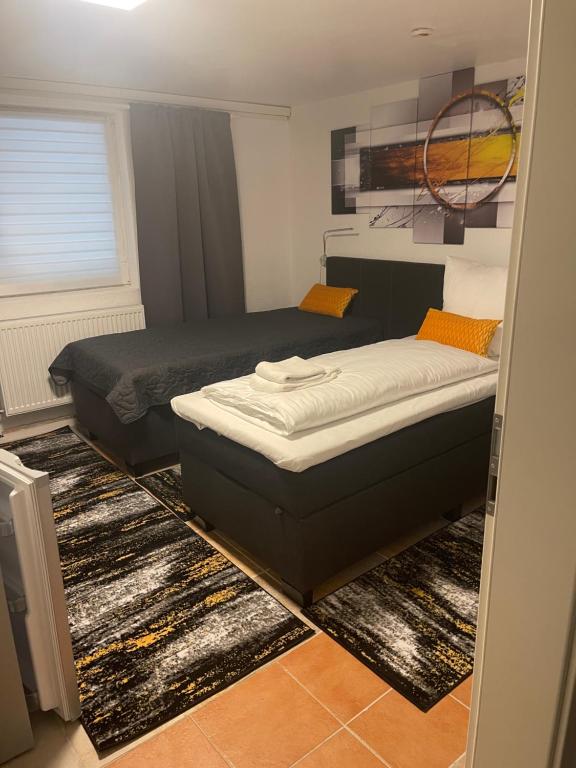 Postel nebo postele na pokoji v ubytování Hotel Am Wildpark