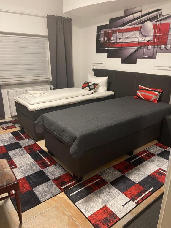 Postel nebo postele na pokoji v ubytování Hotel Am Wildpark