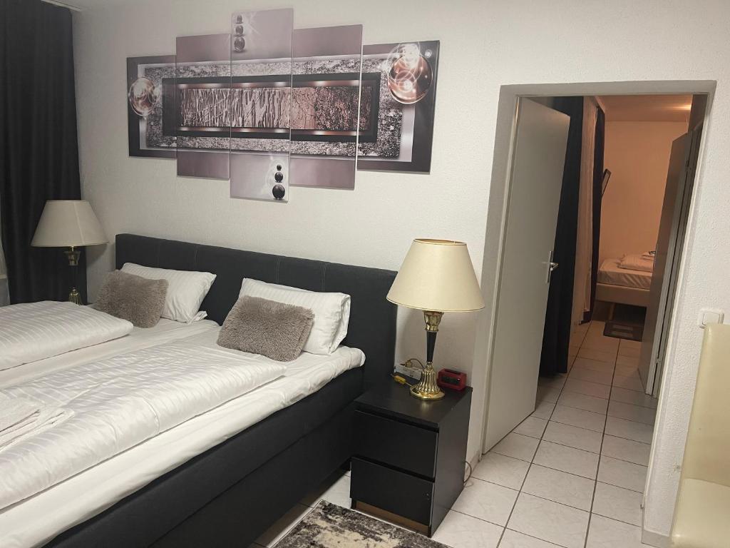 Postel nebo postele na pokoji v ubytování Hotel Am Wildpark