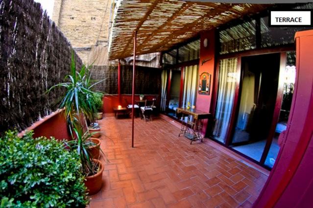 a room with plants on the floor of a building at Family apartment Plaza España in Barcelona