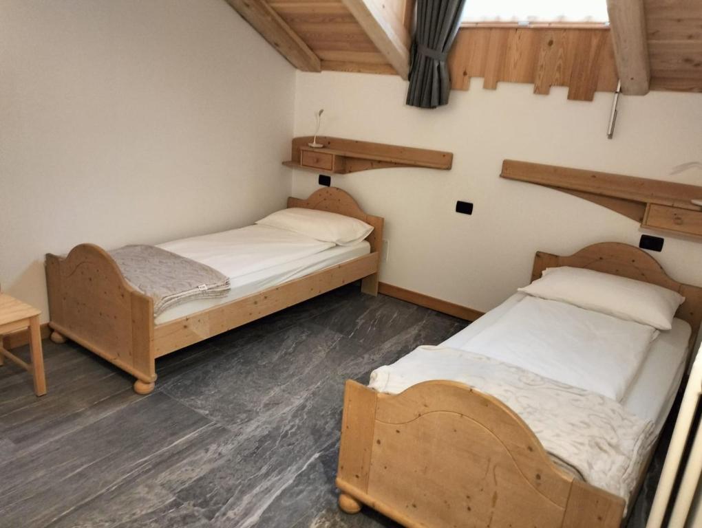 Postel nebo postele na pokoji v ubytování Appartamenti Donini Alfredo