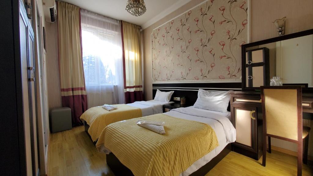 Postel nebo postele na pokoji v ubytování Hotel Antalia