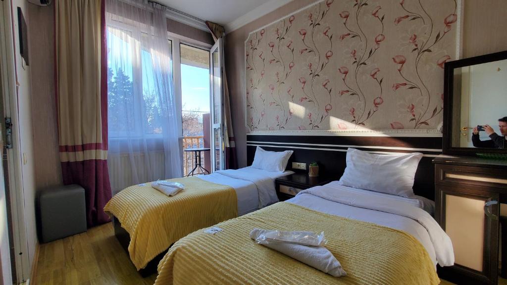 Postel nebo postele na pokoji v ubytování Hotel Antalia