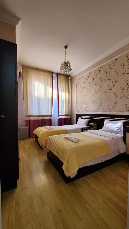 Postel nebo postele na pokoji v ubytování Hotel Antalia