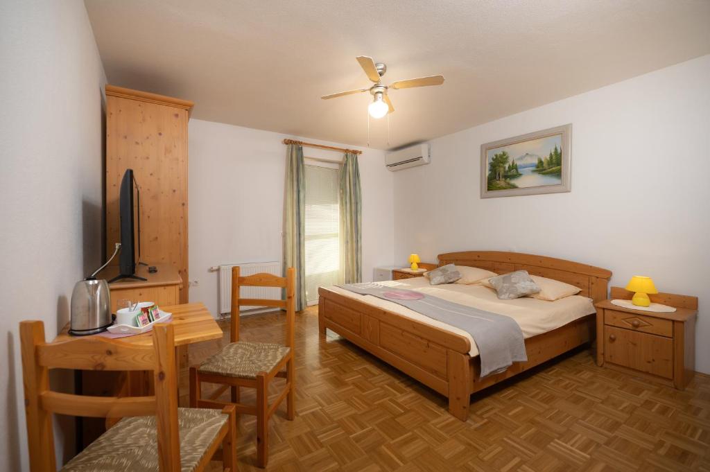 Postel nebo postele na pokoji v ubytování Rooms & Apartments Pr Matjon