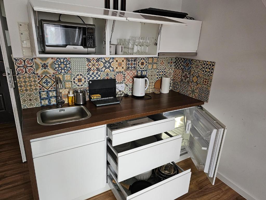 Kuchyňa alebo kuchynka v ubytovaní Willa Kolor Pokoje Apartamenty Restauracja