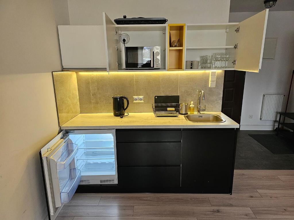 Kuchyňa alebo kuchynka v ubytovaní Willa Kolor Pokoje Apartamenty Restauracja