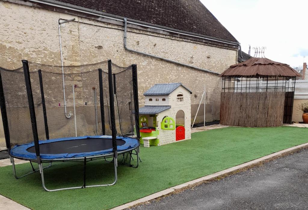 a playground with a trampoline and a play structure at 5km de beauval, gîte l'étoile des châteaux in Noyers-sur-Cher