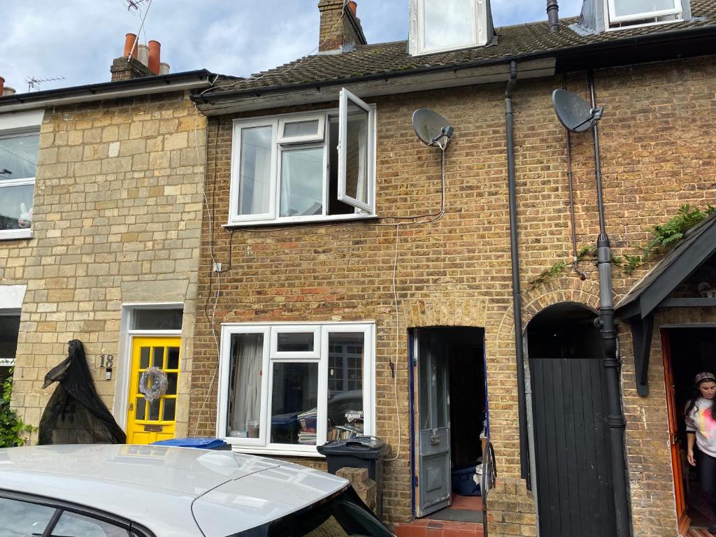 a brick house with a car parked in front of it at Stunning 1-Bed Studio in Windsor in Windsor