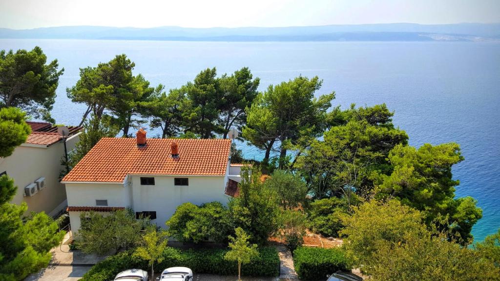 a house with a view of the water at Villa Matejo in Mimice