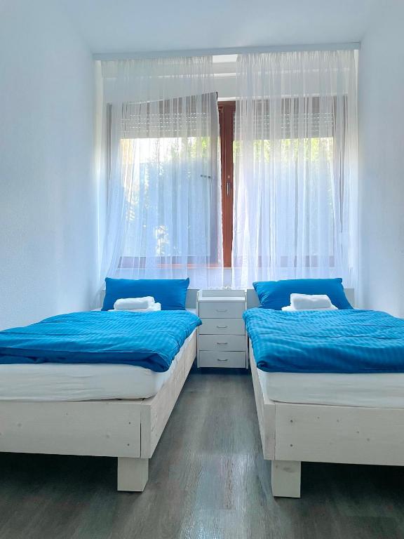 Postel nebo postele na pokoji v ubytování Stay Westend