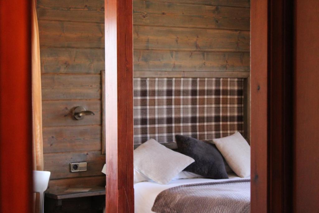 Postel nebo postele na pokoji v ubytování Hotel Calitxo