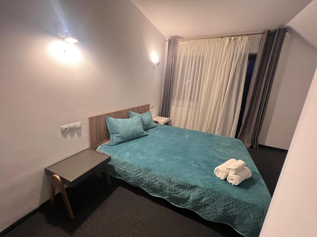 Postel nebo postele na pokoji v ubytování TURQUOISE HOUSE