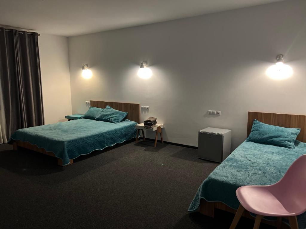 Postel nebo postele na pokoji v ubytování TURQUOISE HOUSE