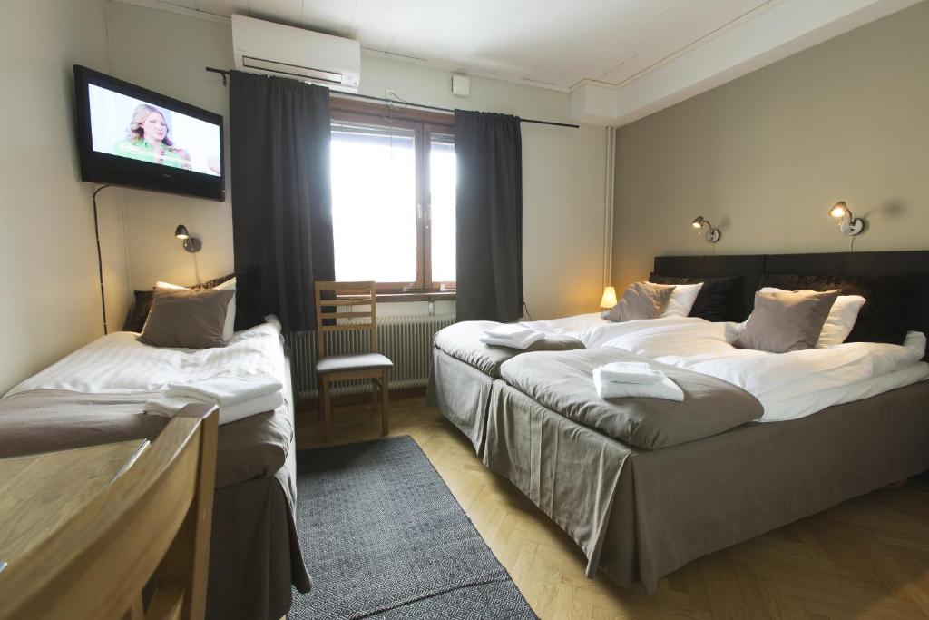Postel nebo postele na pokoji v ubytování Park Hotell