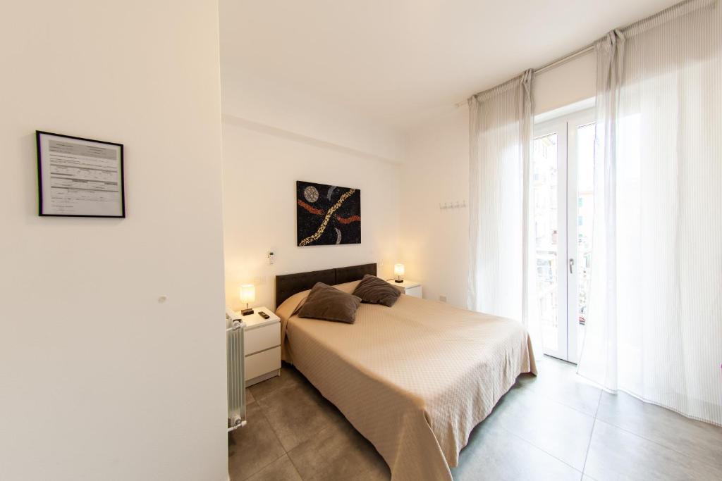 Postel nebo postele na pokoji v ubytování La Spezia Holidays 123