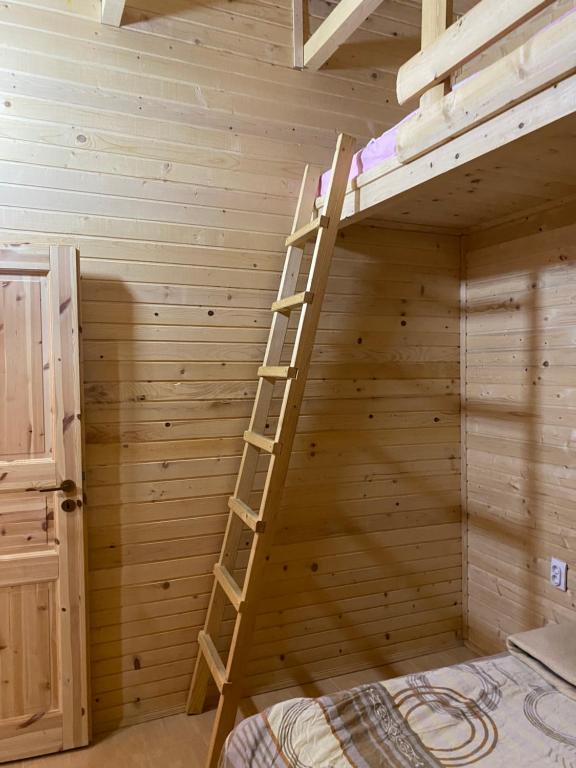 Postel nebo postele na pokoji v ubytování Brvnara Gradišnjica