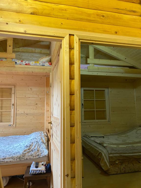 Postel nebo postele na pokoji v ubytování Brvnara Gradišnjica