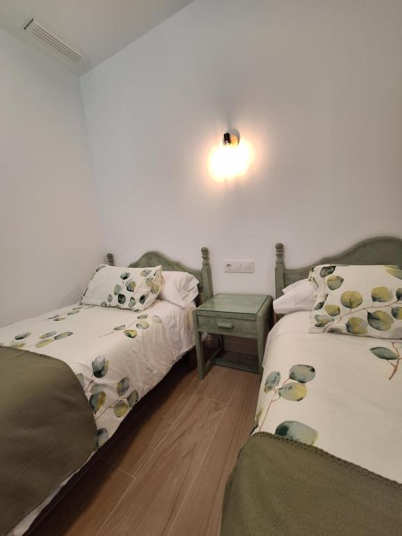 Łóżko lub łóżka w pokoju w obiekcie Casas Rurales Los Marqueses